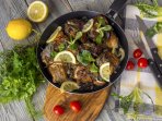 Хек по-єврейськи із цибулею