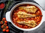Хек у духовці з помідорами