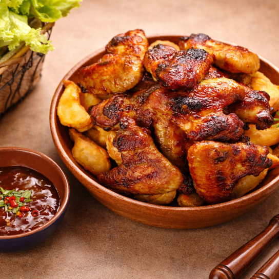 Курячі крильця запечені з картоплею