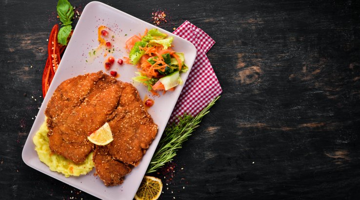 Свинячі відбивні в паніровці